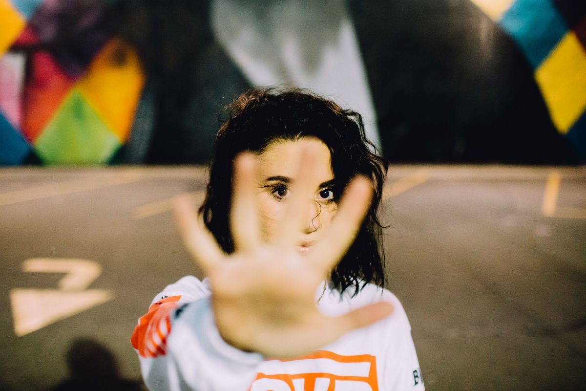 woman showing her hand to stop