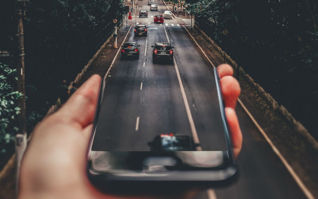 Smartphone merging into busy road